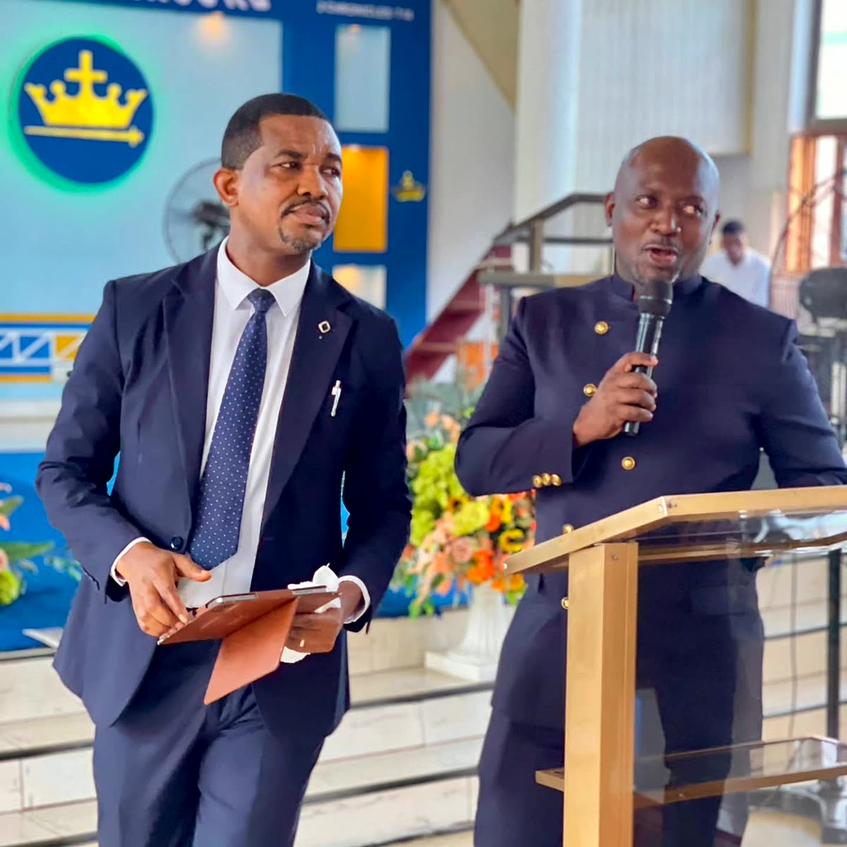 Apostle Lambert with the host at the pulpit in Accra